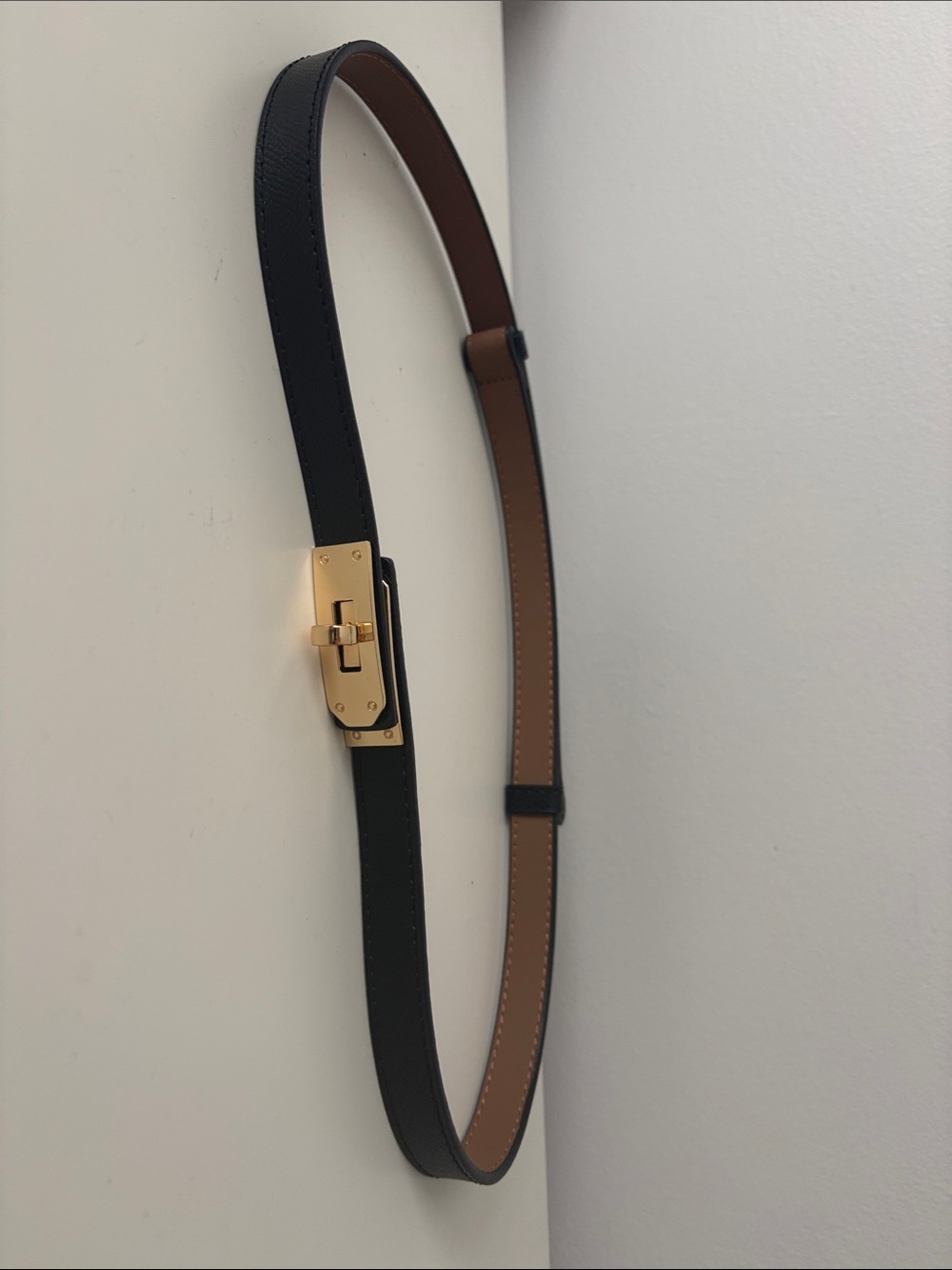 Inspired adjustable belt with turn lock